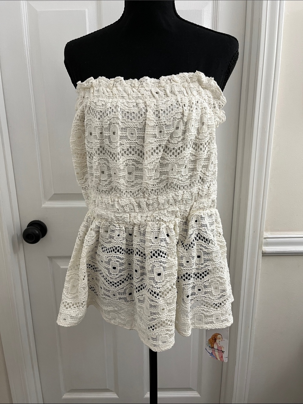 PrettyGardener Ivory Crochet Strapless Peplum Top